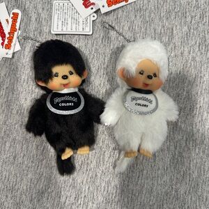 Brand new, unused Monchhichi keychain in black and white. NWT